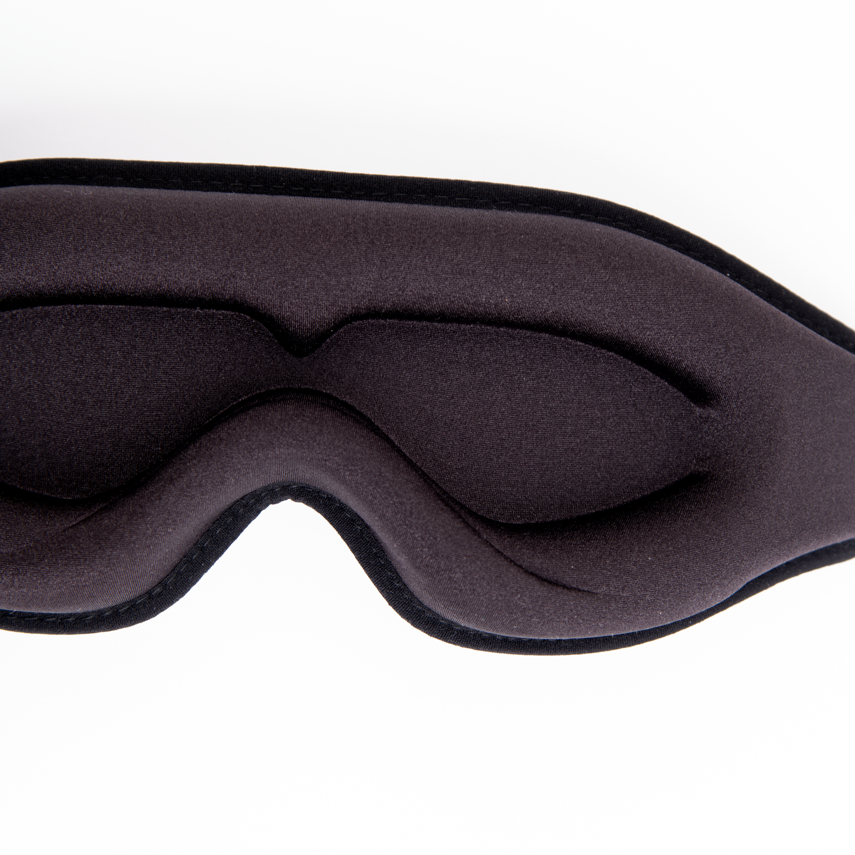 Close-up of the silky texture of the black sleep masks 